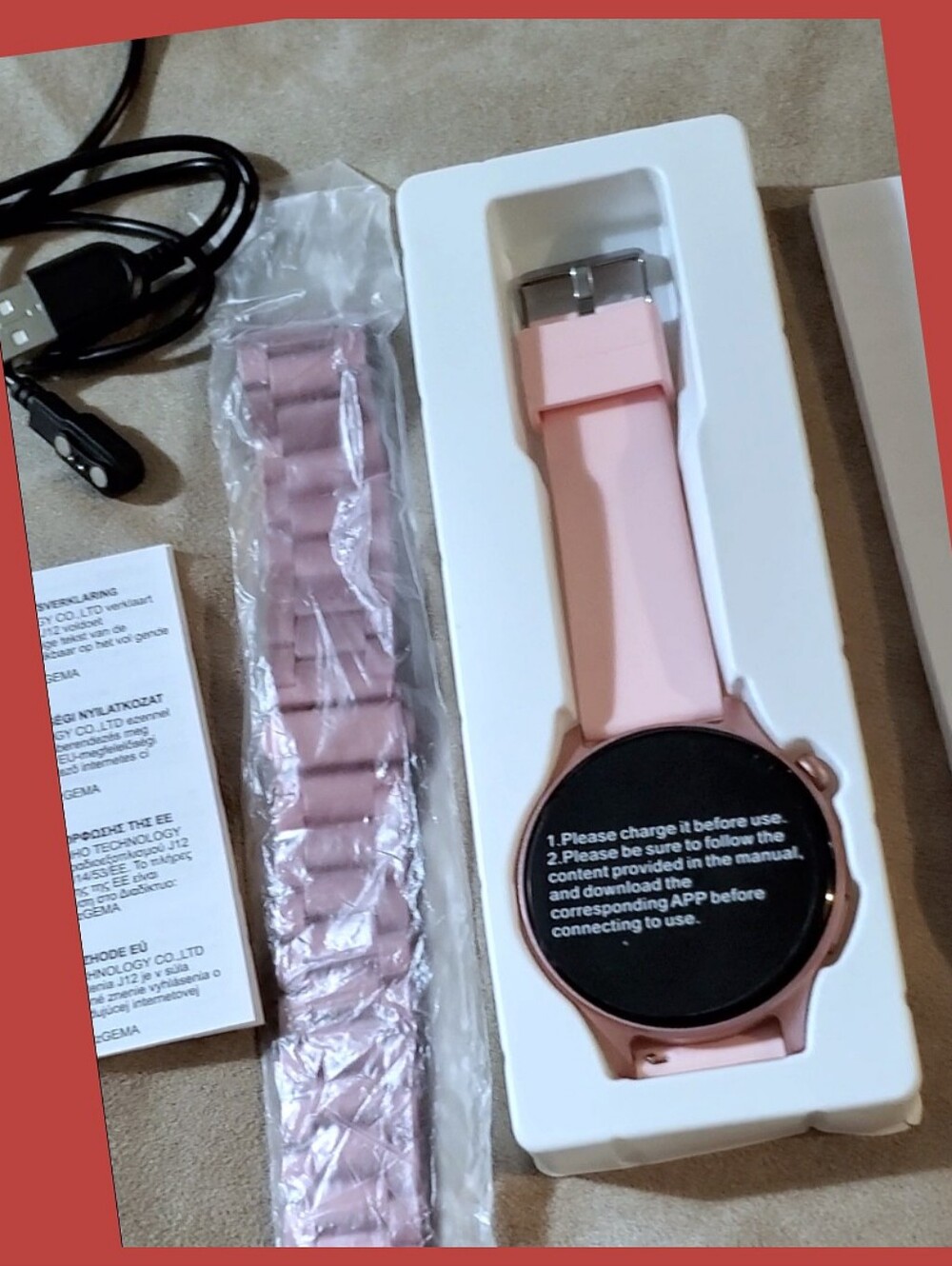 Pink Smartwatch with extra Band and Accessories